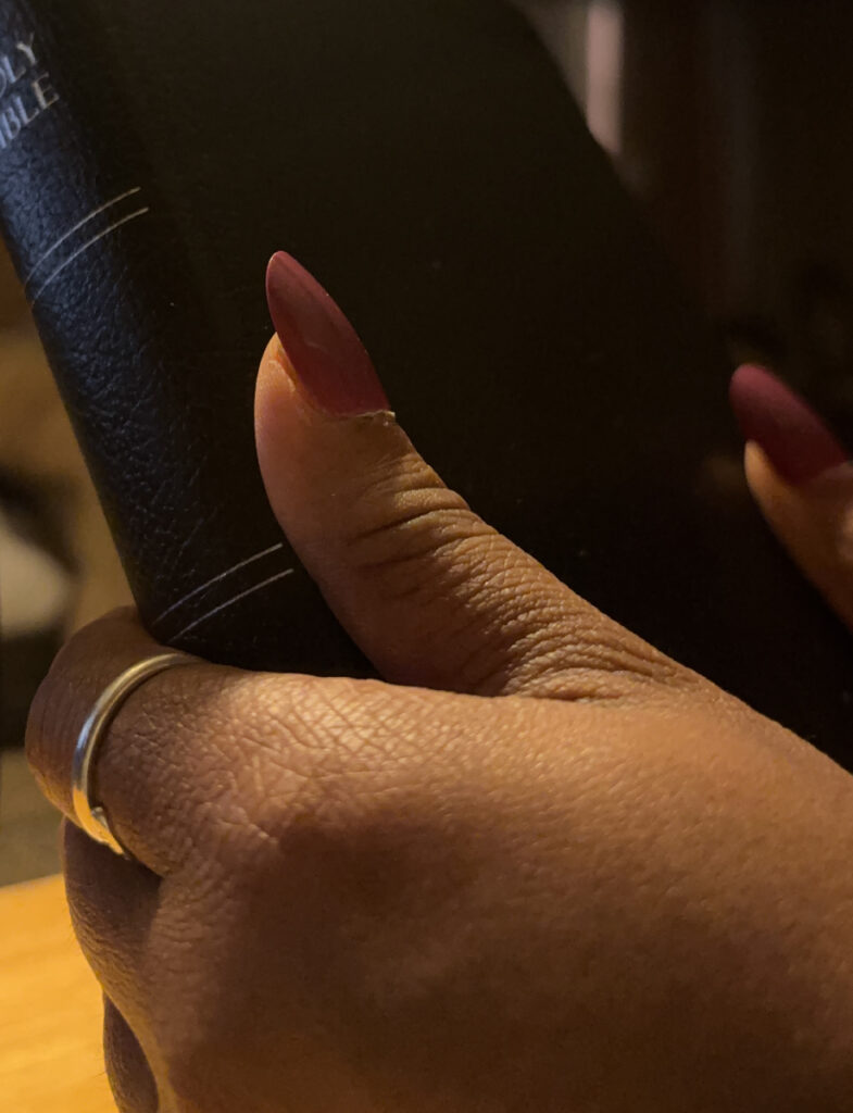 Hands Holding The Bible